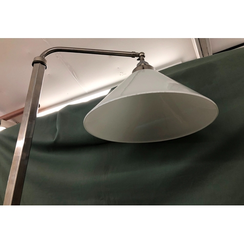 2010 - A metallic floor lamp with white glass shade, extending height (slight dents to base and part missin... 