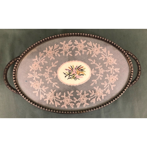 2024 - An embroidered oval dressing table tray, 35.5cm wide 20.7cm deep, a Nao group of 2 young boys throwi... 