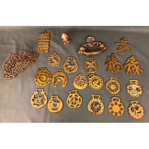 2036 - A quantity of various horse brasses and other brass items.