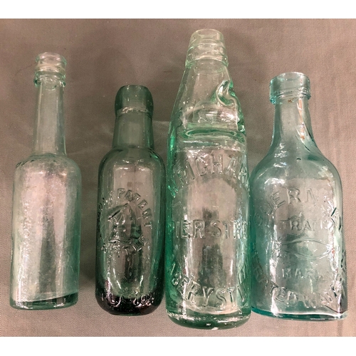 2053 - A collection of glass bottles including, W. Richards Pier Street Aberystwyth, Barrett & Co London, G... 