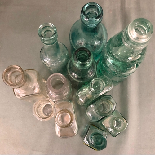 2053 - A collection of glass bottles including, W. Richards Pier Street Aberystwyth, Barrett & Co London, G... 