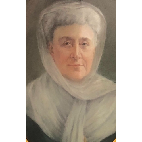 2074 - An oval pastel shoulder length portrait of an elderly lady wrapped in white scarf, 54.5cm x 39.5cm, ... 