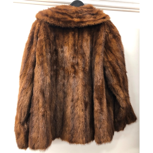 2083 - A chestnut brown short fur coat labelled Theodore Roach Melton Court 15 Old Brompton Road London S.W... 