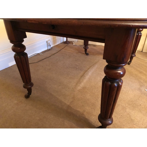 2087 - A Victorian mahogany key wind table on ceramic castors, 147cm wide open, 102cm deep, 72cm high (some... 