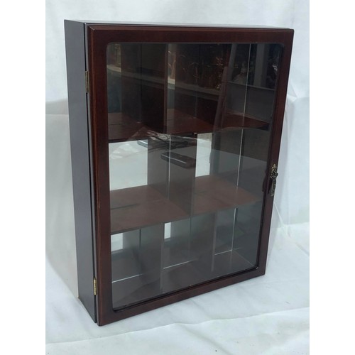 2291 - A small display cabinet with wall mountings, glass hinged door enclosing interior sections and mirro... 