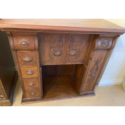 2339 - A small desk/sewing table with carved detail to drawers and door fronts, interior drawer compartment... 