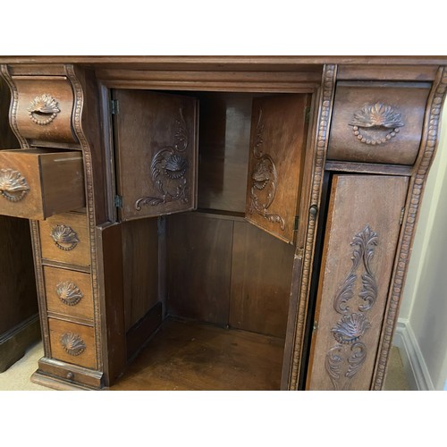 2339 - A small desk/sewing table with carved detail to drawers and door fronts, interior drawer compartment... 