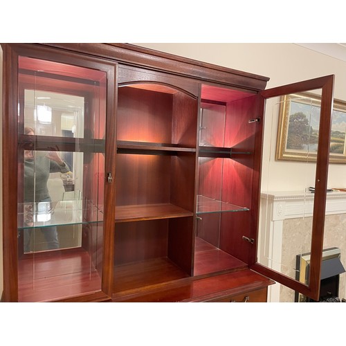 2341 - A large dresser with 3 cupboard doors, 3 drawers, 2 upper glass display cupboards with mirrored back... 