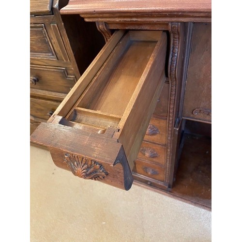 2339 - A small desk/sewing table with carved detail to drawers and door fronts, interior drawer compartment... 