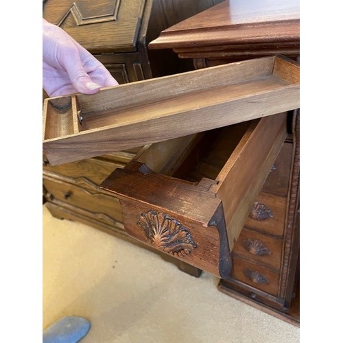 2339 - A small desk/sewing table with carved detail to drawers and door fronts, interior drawer compartment... 