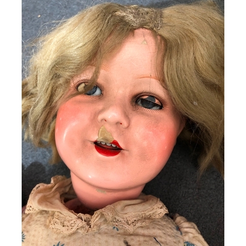 2068 - A K&W Germany doll numbered 122/7 with jointed body, 54cm long (damage to head) and another jointed ... 