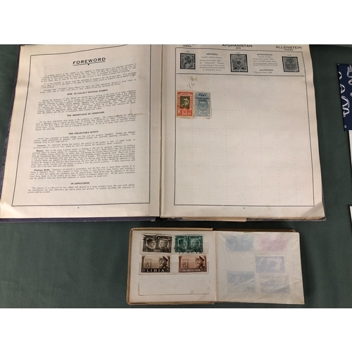 2100 - 2 stamps albums containing a collection of worldwide stamps and various First Day Covers.