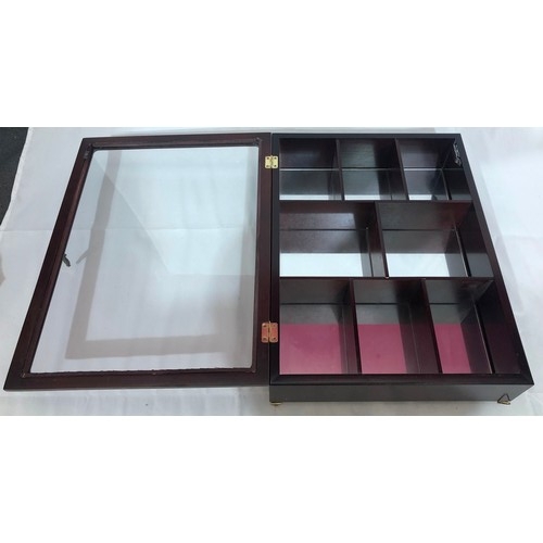 2291 - A small display cabinet with wall mountings, glass hinged door enclosing interior sections and mirro... 