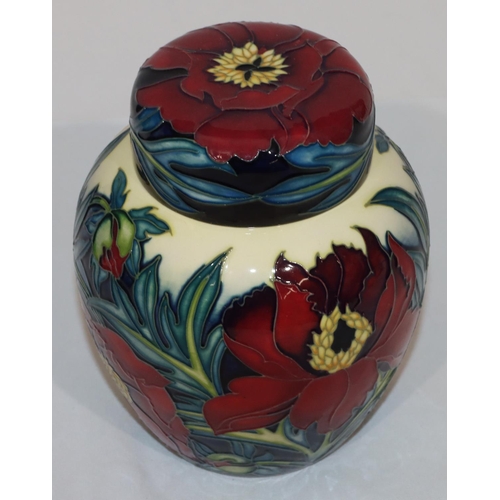 102 - A modern Moorcroft round bulbous thin necked ginger jar with cover on yellow, red and blue ground wi... 