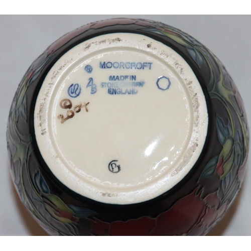 102 - A modern Moorcroft round bulbous thin necked ginger jar with cover on yellow, red and blue ground wi... 