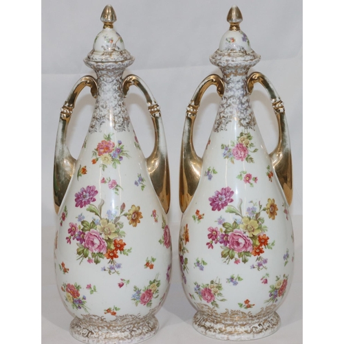 110 - A pair of Continental round bulbous thin necked 2-handled lidded vases on white ground with multi-co... 