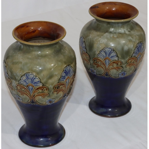 115 - A pair of Royal Doulton glazed earthenware round bulbous thin necked trumpet shaped vases on green a... 