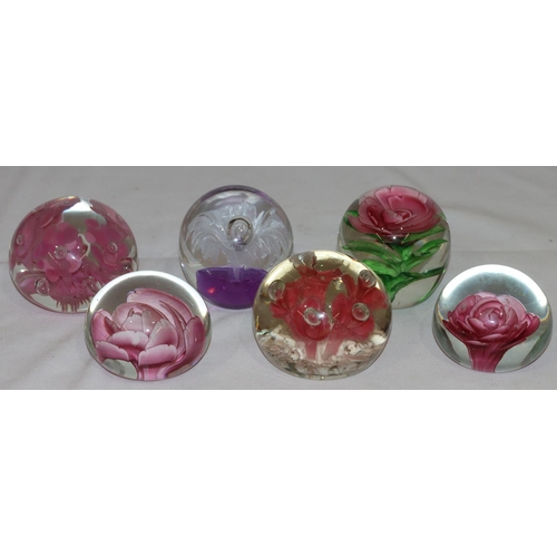 155 - Joe Rice glass round bulbous shaped paperweight with inner pink floral decoration and 5 various othe... 