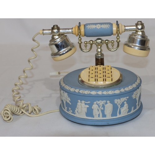 171 - A Wedgwood circular Jasperware telephone with allover raised figure decoration, 19cm high