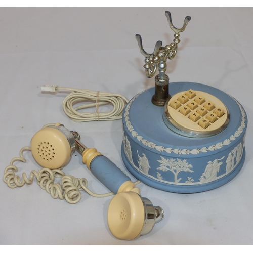 171 - A Wedgwood circular Jasperware telephone with allover raised figure decoration, 19cm high