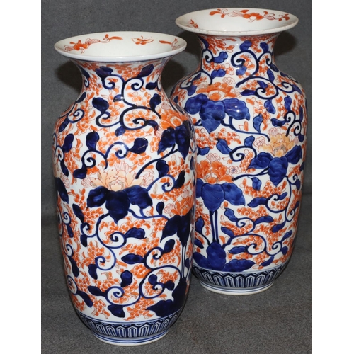 21 - A pair of Imari round bulbous thin necked trumpet shaped vases on white, red and blue ground with al... 