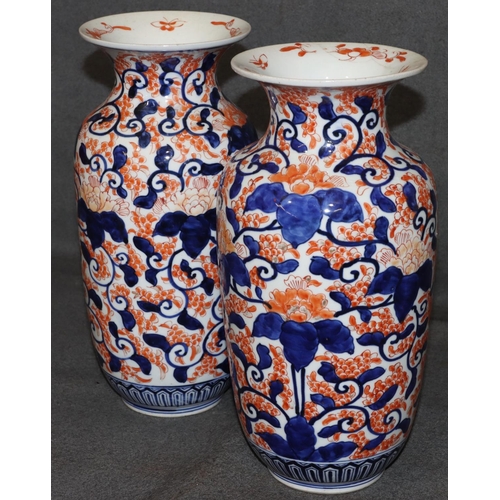 21 - A pair of Imari round bulbous thin necked trumpet shaped vases on white, red and blue ground with al... 