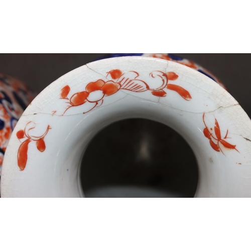 21 - A pair of Imari round bulbous thin necked trumpet shaped vases on white, red and blue ground with al... 