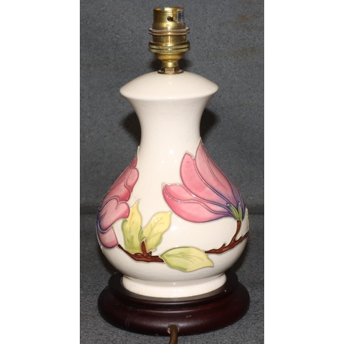 24 - A modern Moorcroft small round bulbous thin necked table lamp on cream ground with multi-coloured fl... 