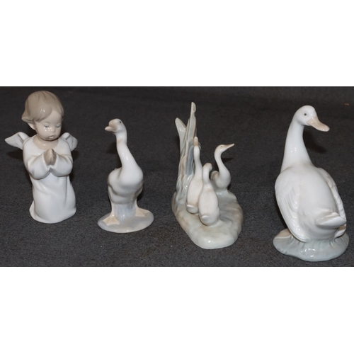 27 - A Lladro figure of a kneeling angel, 13cm high, a Lladro figure of a goose and 2 Nao figures of gees... 