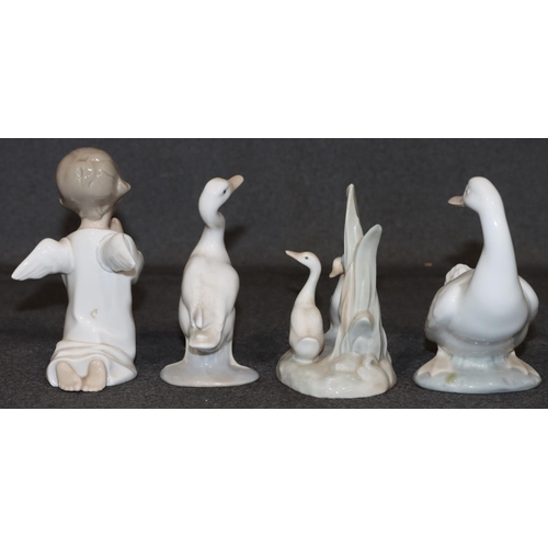 27 - A Lladro figure of a kneeling angel, 13cm high, a Lladro figure of a goose and 2 Nao figures of gees... 