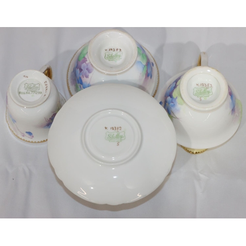 53 - A Shelley tea service on white and cream ground with multi-coloured floral, leaf and gilt decoration... 