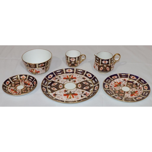 54 - A Royal Crown Derby Imari pattern tea service, comprising of a pair of cake plates (1 chipped), milk... 