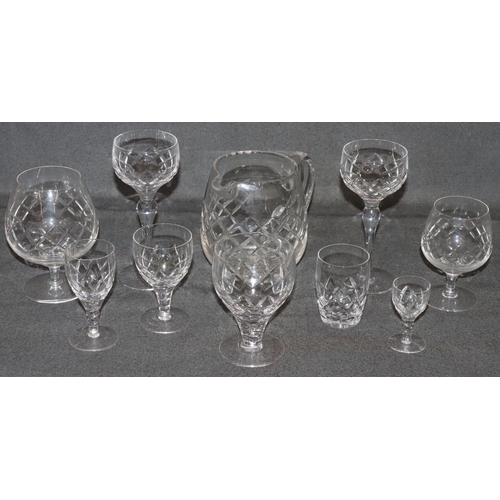 6 - A Stuart crystal cut glass service, comprising of 12 hock glasses, 9 wine glasses, 10 small glasses,... 