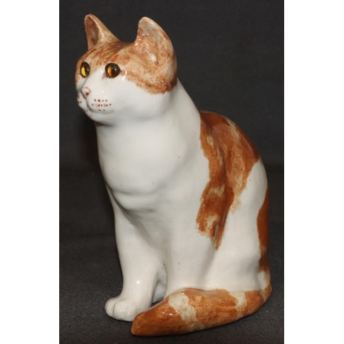 63 - A Winstanley model of a seated ginger cat with glass eyes, 29.5cm high