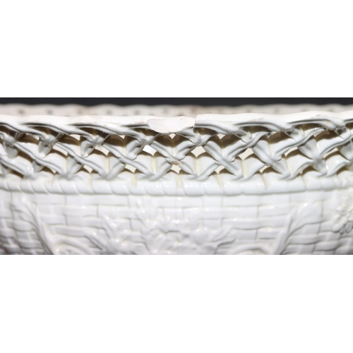 64 - A Creamware rectangular shaped 2-handled basket with pierced decoration on white and green ground wi... 