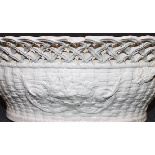 64 - A Creamware rectangular shaped 2-handled basket with pierced decoration on white and green ground wi... 