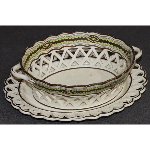 65 - An early Creamware oval 2-handled basket with scallop shaped rim with pierced gallery, brown and yel... 