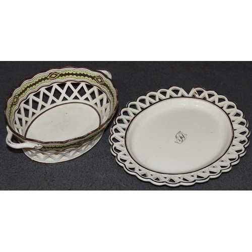 65 - An early Creamware oval 2-handled basket with scallop shaped rim with pierced gallery, brown and yel... 