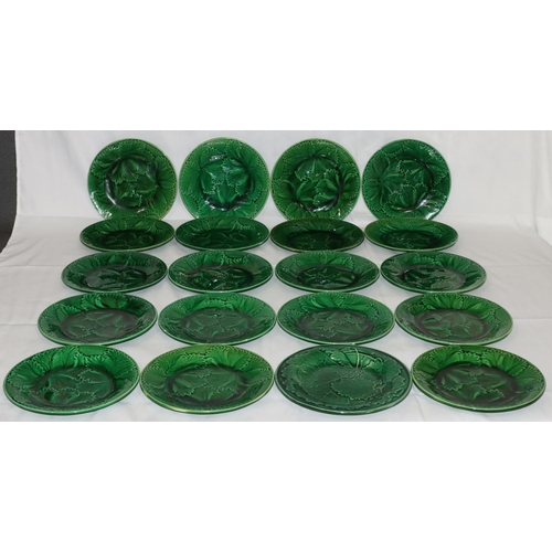 69 - 20 green glazed round plates with leaf decoration, 20cm diameter (3 chipped)