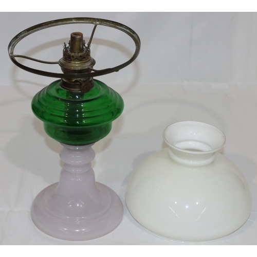 77 - An Opaline and green glass paraffin lamp, with shade (no chimney), 44cm high