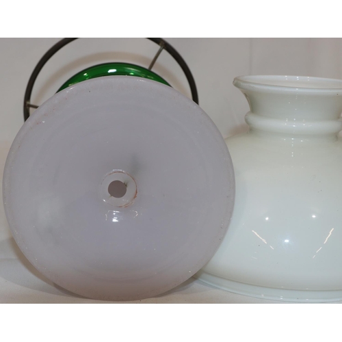 77 - An Opaline and green glass paraffin lamp, with shade (no chimney), 44cm high