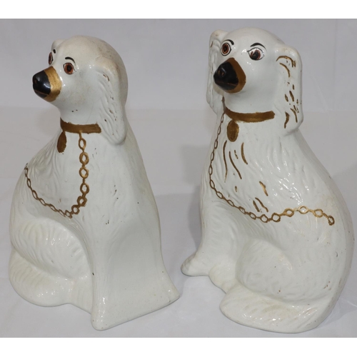 91 - A pair of 19th Century Staffordshire figures of seated spaniels with gilt chains and painted eyes, 3... 