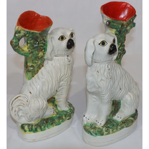 93 - A pair of 19th Century Staffordshire spill vase groups of 2 seated spaniels with painted eyes, large... 