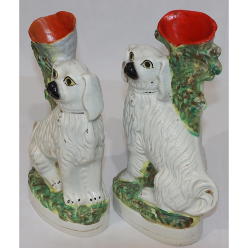 93 - A pair of 19th Century Staffordshire spill vase groups of 2 seated spaniels with painted eyes, large... 