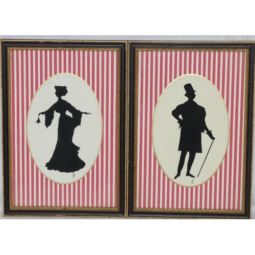 196 - A pair of oval silhouettes, 16cm x 11cm,  depicting standing gentleman and lady, in Hogarth frames