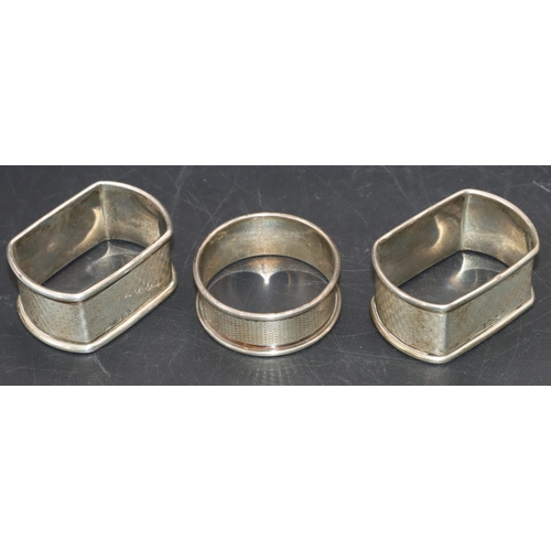 234 - A pair of Sheffield silver rectangular shaped napkin rings with engine turned decoration and a Birmi... 