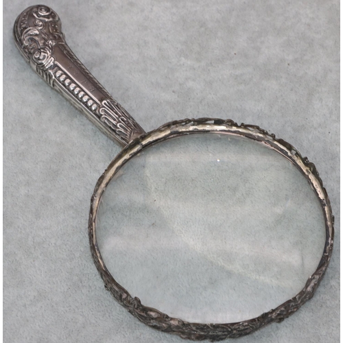 239 - A Victorian silver mounted large round tabletop magnifying glass with raised animal, cupid, bird and... 