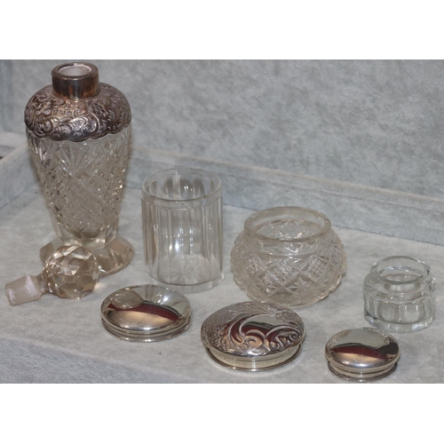 242 - A cut glass round bulbous shaped dressing table bottle with Birmingham silver embossed neck with sto... 