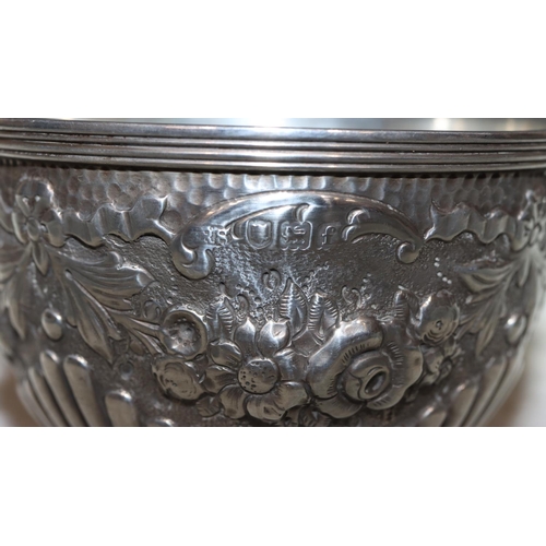 249 - An Edward VII silver round sugar bowl with allover embossed fluted swag, floral and leaf decoration,... 