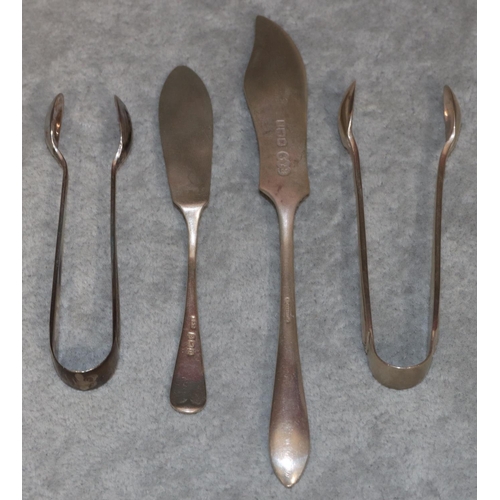 253 - A pair of London silver sugar tongs, a pair of Sheffield silver sugar tongs and 2 silver butter kniv... 